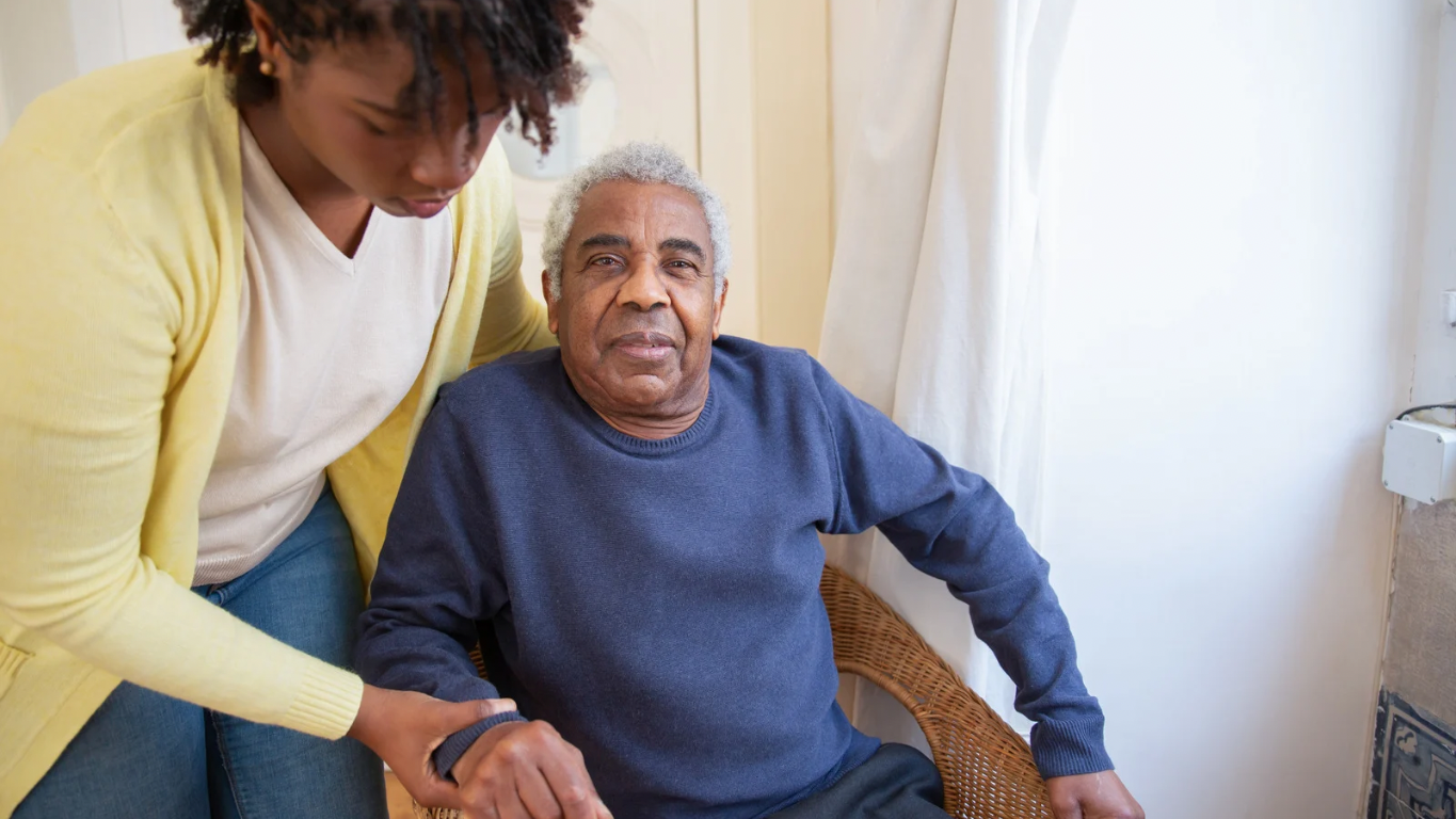 Smiling senior woman enjoying conversation with caregiver